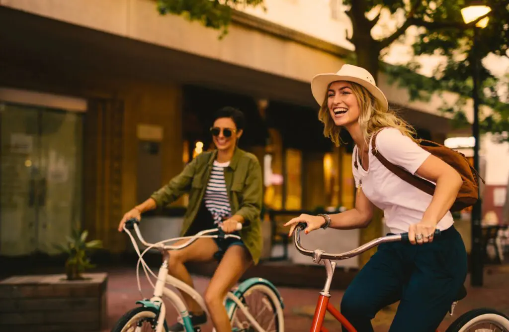 Two women enjoying bicycle ride. Naturopath North Brisbane. Brisbane Livewell Clinic. Hypnotherapy for Smoking. Hypnotherapy for Alcohol Addiction. Gastric Band Hypnosis. Brisbane Livewell Clinic