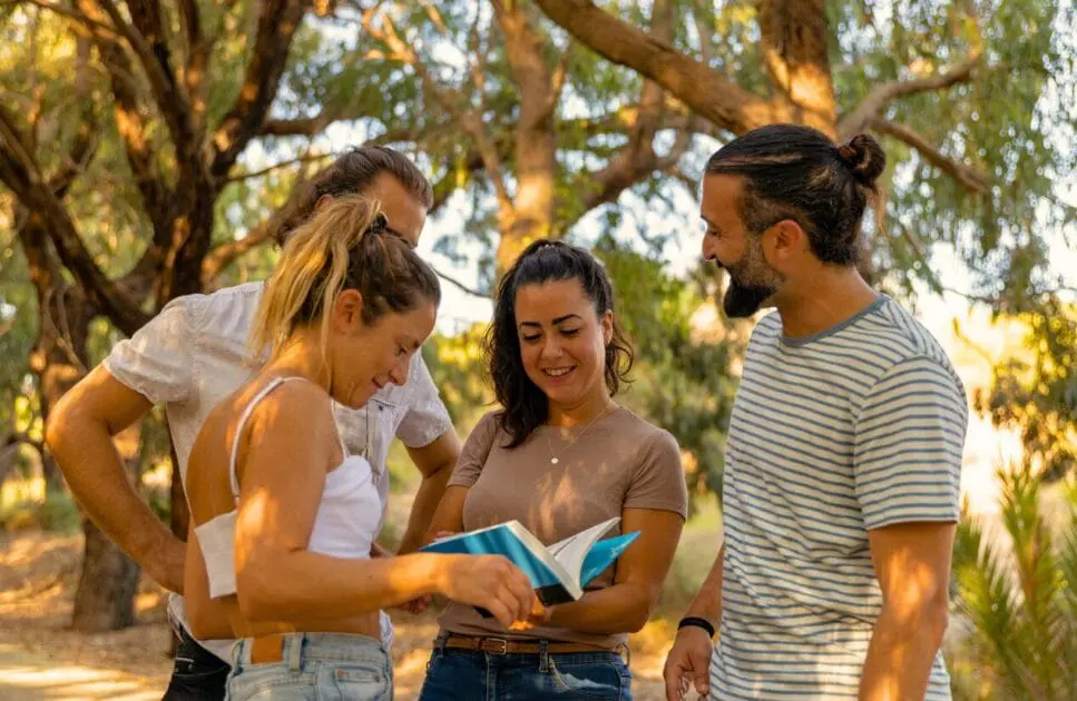 Four young friends standing together in a park. Grief and Bereavement Counselling. Test Cortisol at Home. Brain Ageing. Brisbane Livewell Clinic