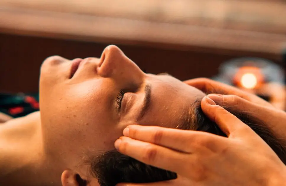 Close-up of a woman getting head Massage. What is Indian Head Massage. Naturopath. Wellness Centre. Head Massage Near Me. Indian Head Massage. Brisbane Livewell Clinic