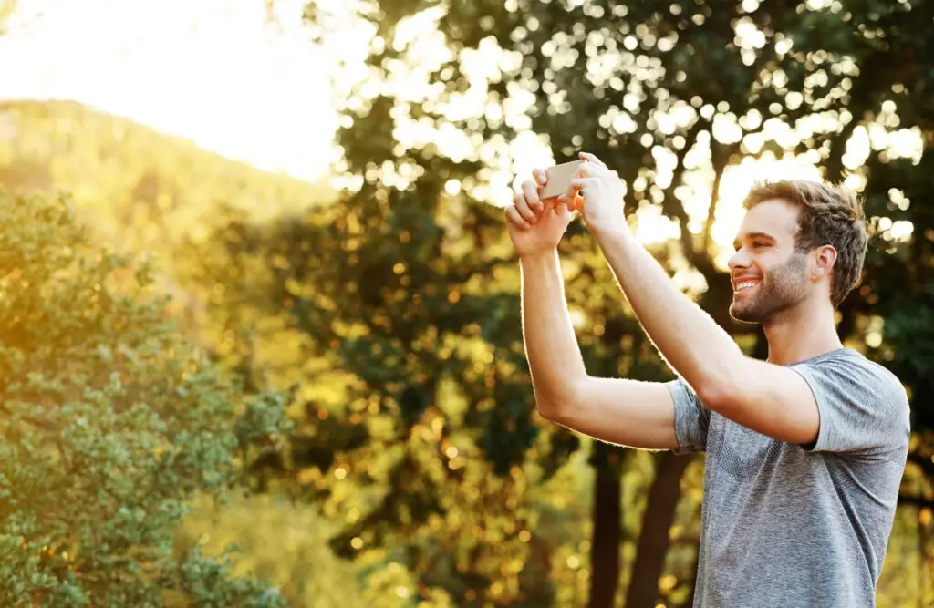 Man taking a photo of the beautiful view in front of him. Counselling Nundah. Brisbane Livewell Clinic