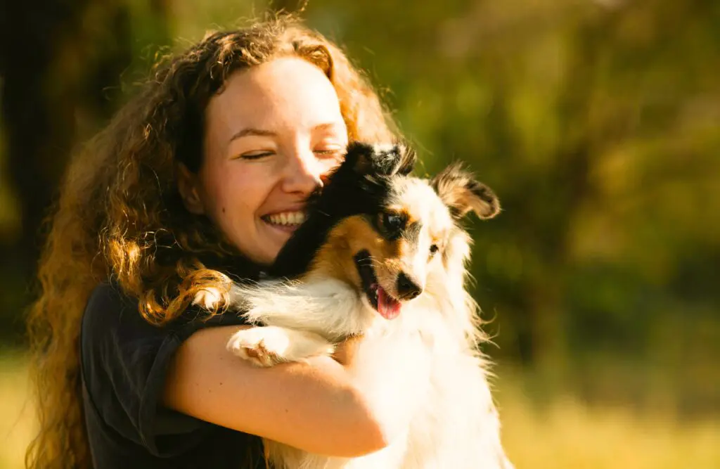Happy woman hugging her dog. Counselling Wooloowin. Brisbane Livewell Clinic