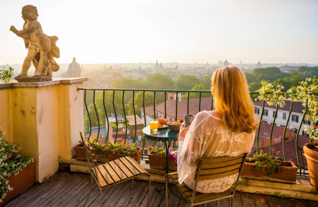 Woman relaxing on the balcony, sipping a cup of coffee. Understanding the Magic of Bowen Technique. Reducing your Body's Toxin Burden. Holistic Counselling Wavell Heights. Osteopath for Back Pain. Brisbane Livewell Clinic