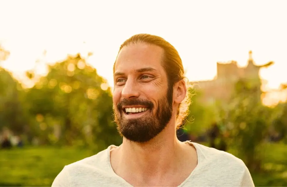 Man smiling and standing in a park. Brisbane Counselling Centre. Pyrrole Disorder. Massage Bowen Secrets. Holistic Counselling Clayfield. Can an Osteopath Support Jaw Pain and TMJ Issues. Brisbane Livewell Clinic