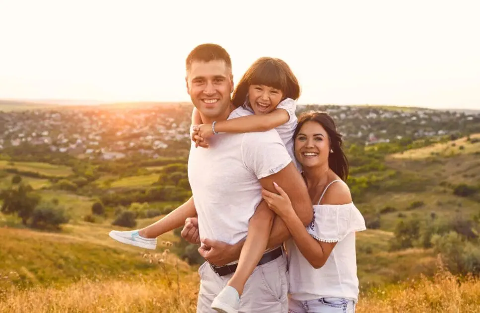 Family standing together in a field. Pyrrole Disorder. Marriage Counselling Brisbane at Brisbane Livewell Clinic (Wavell Heights)