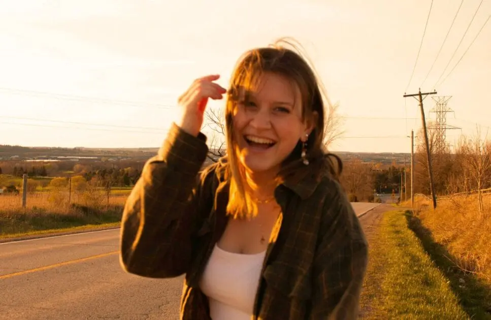 Smiling woman standing on the side of the road. Hypnotherapy near Stafford Heights. Naturopathic remedies for sleep. Hypnotherapy Services Near Brisbane. How Osteopathy may Support Posture and Structural Alignment. Brisbane Livewell Clinic