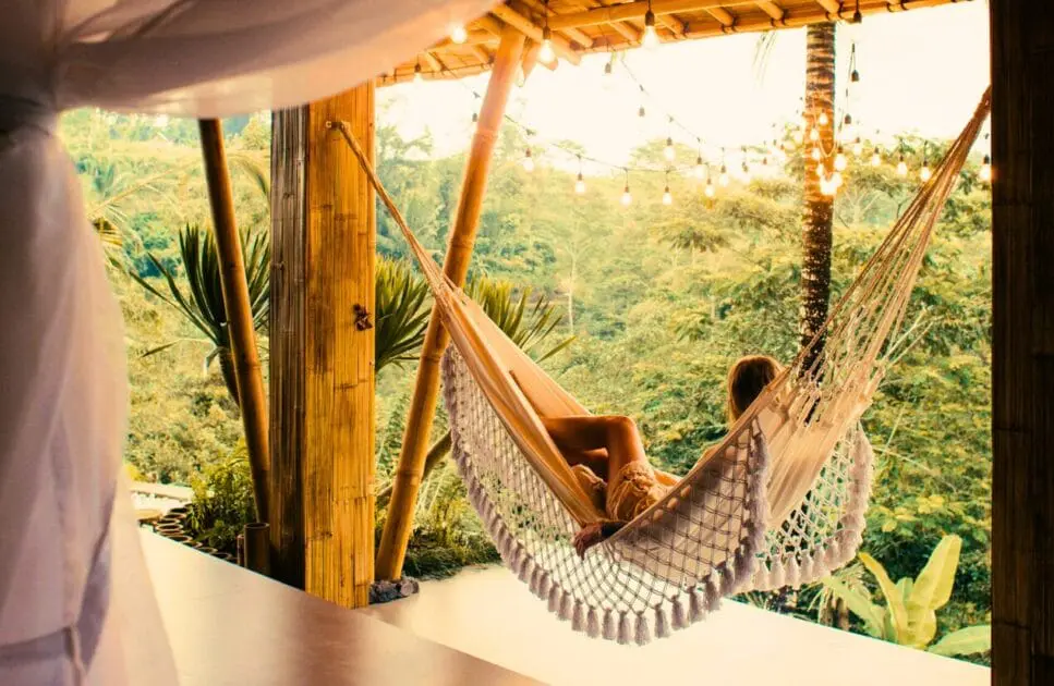 Woman relaxing in a hammock while watching the view. Hypnotherapy near Clayfield. Indian Head massage Brisbane. Burnout Holistic Counselling. Brisbane Livewell Clinic
